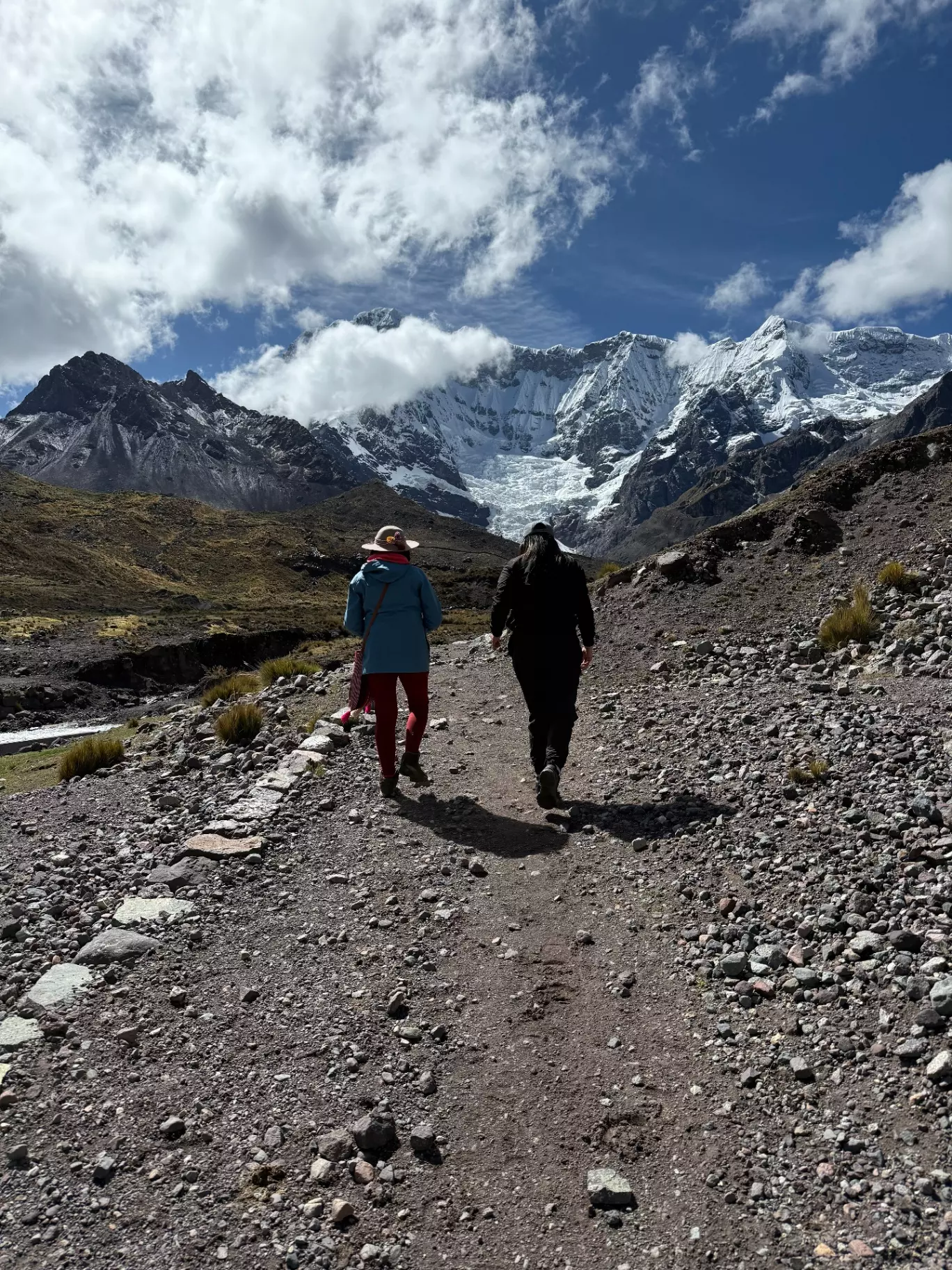 Sacred Ausangate Mountain and turquoise lake in the Peruvian Andes